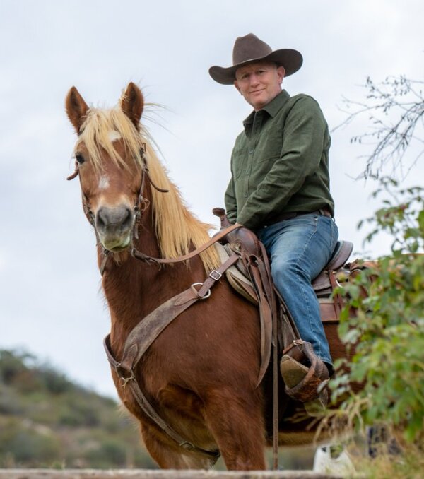 Serge, founder of EquiNex, on horseback with Nelson